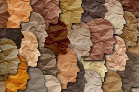 faces made out of paper in different skin tones